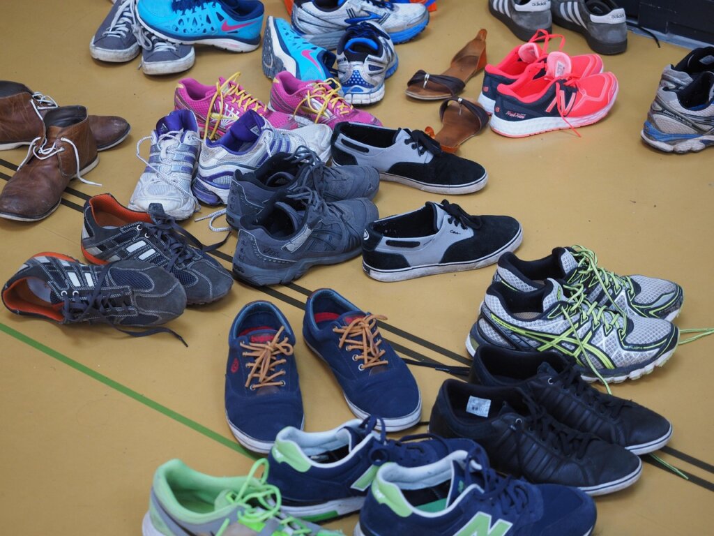 running shoes airing out in apartment hallway