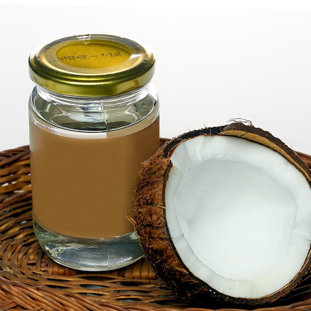 homemade coffee scrub mixture with coconut oil in white bowl