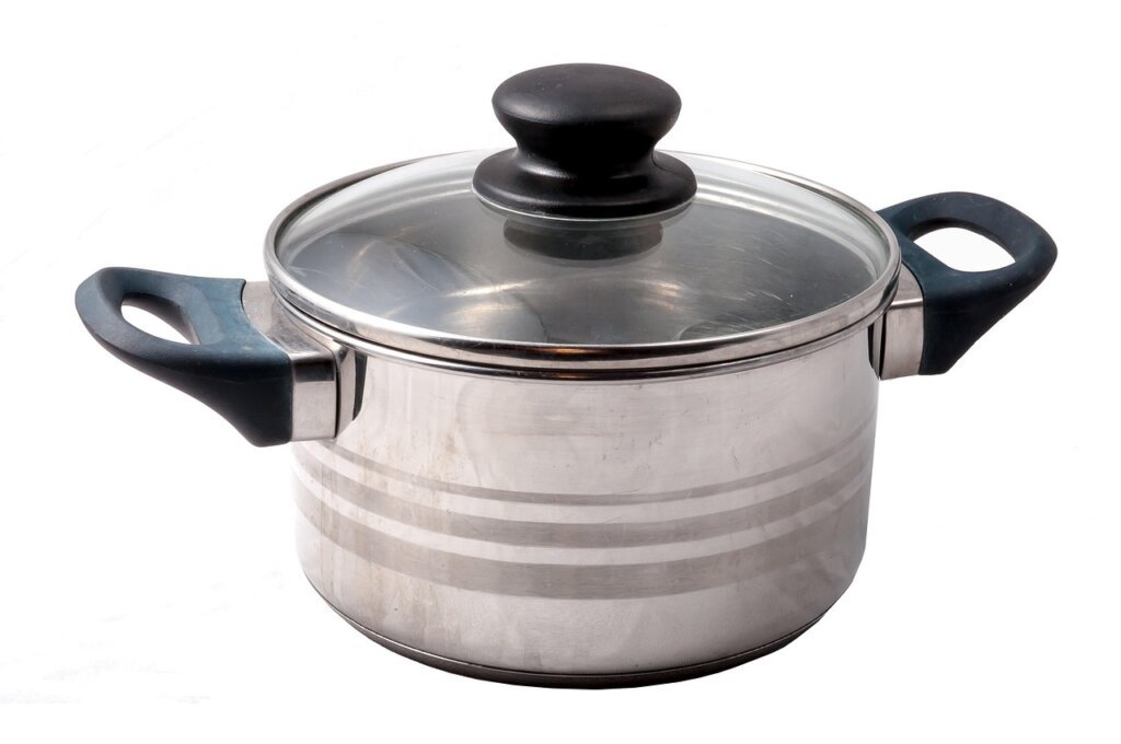 applying thin layer of cooking oil inside clean stainless pot with paper towel