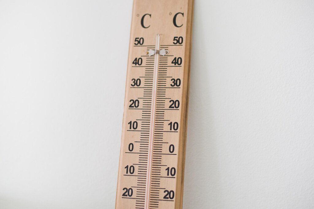 thermometer showing temperature difference near insulated window