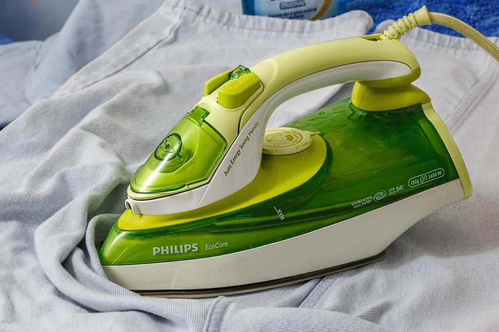 gentle pressing and squeezing laundry in basin