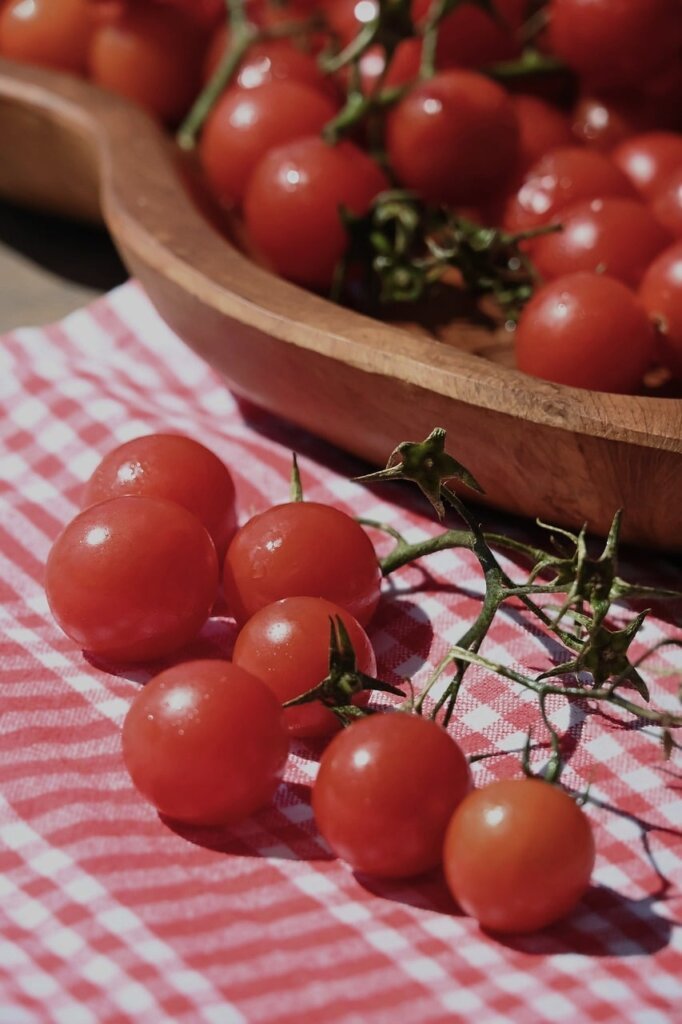 tomatoes separated from other vegetables in fridge