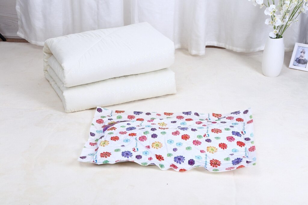 inflated vacuum storage bag on floor indicating air leak