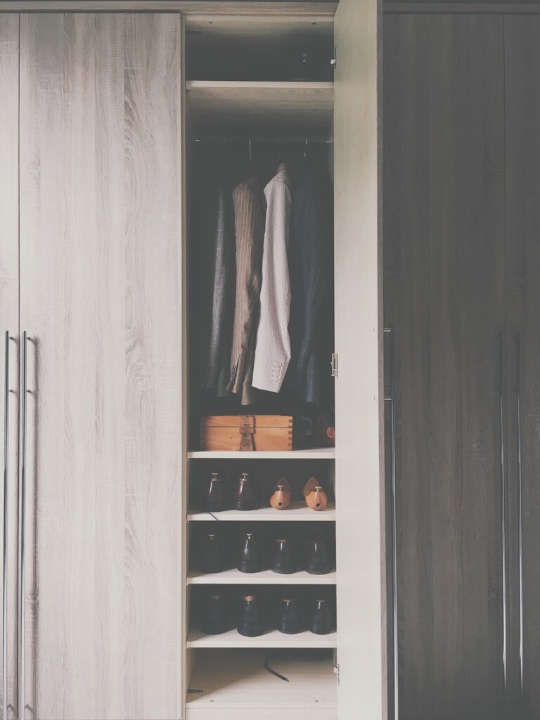 storage bags neatly arranged inside a dry wardrobe shelf