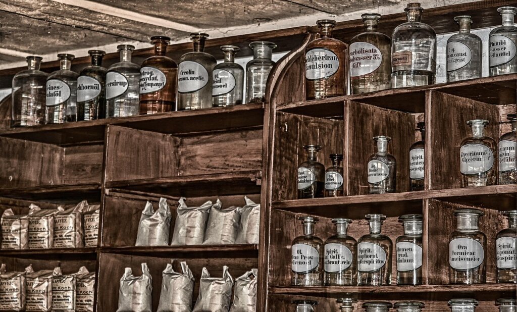wall mounted laundry shelf with spray bottles and small items