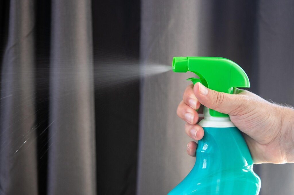 comparison of natural cleaning supplies versus chemical drain cleaner on white background