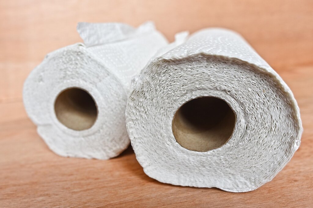 wiping microwave interior with paper towel after steam cleaning