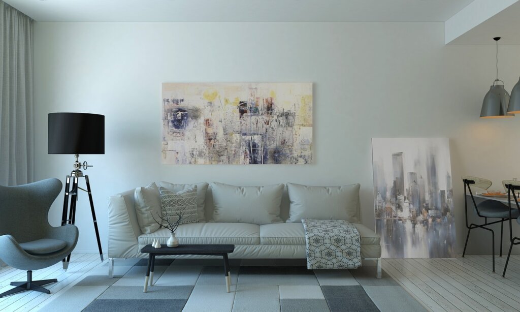 coffee stain on light beige couch cushion with soda water and cloth nearby