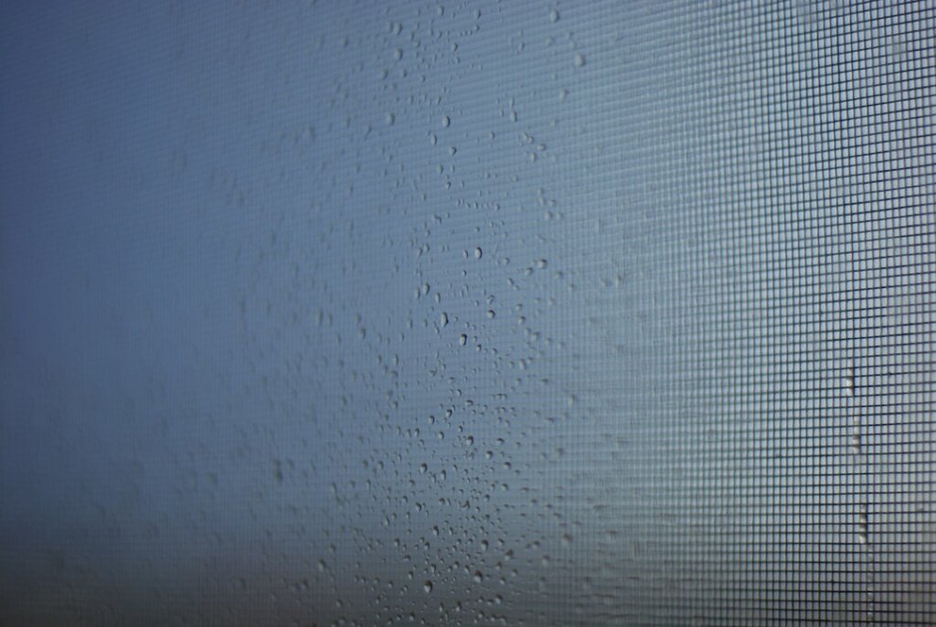 white mineral water stains on glass window closeup