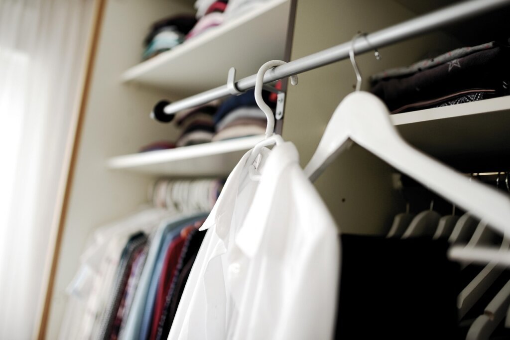 organized wardrobe with multiple dehumidifier types placed strategically