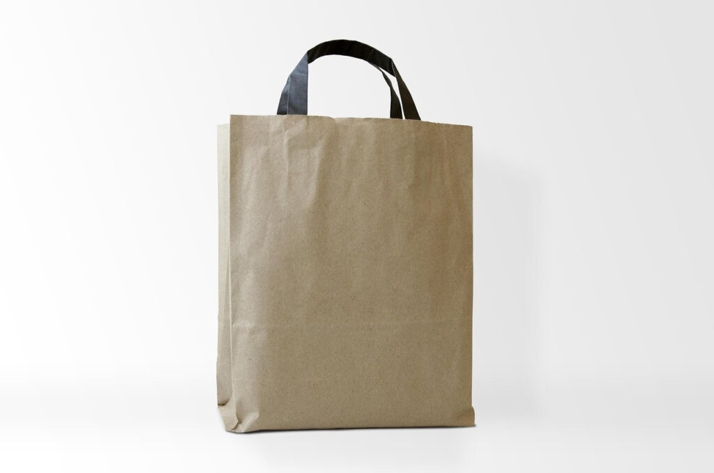 various types of dehumidifier sachets and charcoal bags on white background