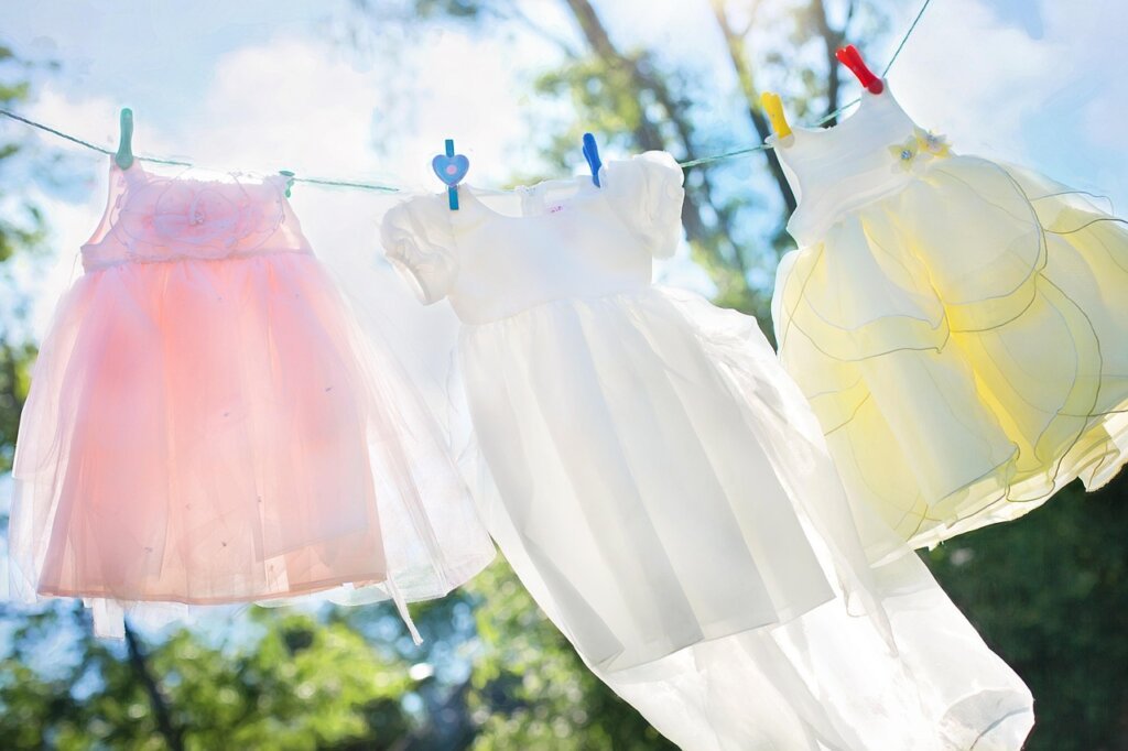 pile of clothes smelling bad after washing on wooden table
