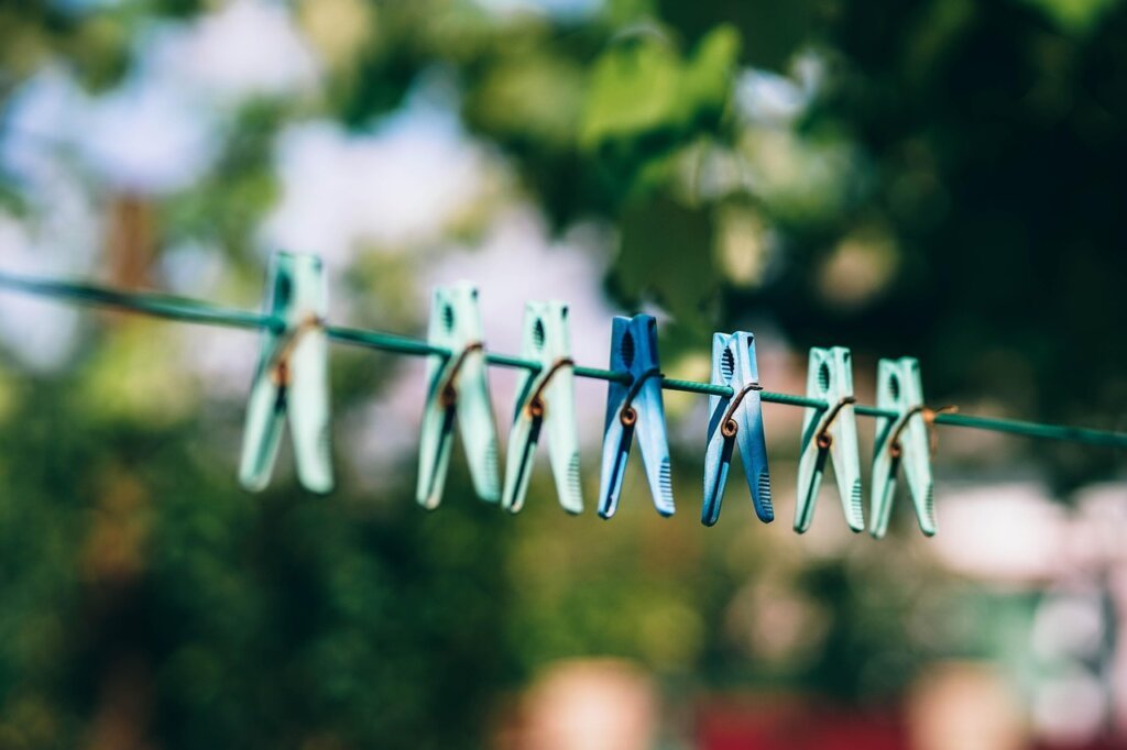 white laundry drying in bright sunlight outdoors