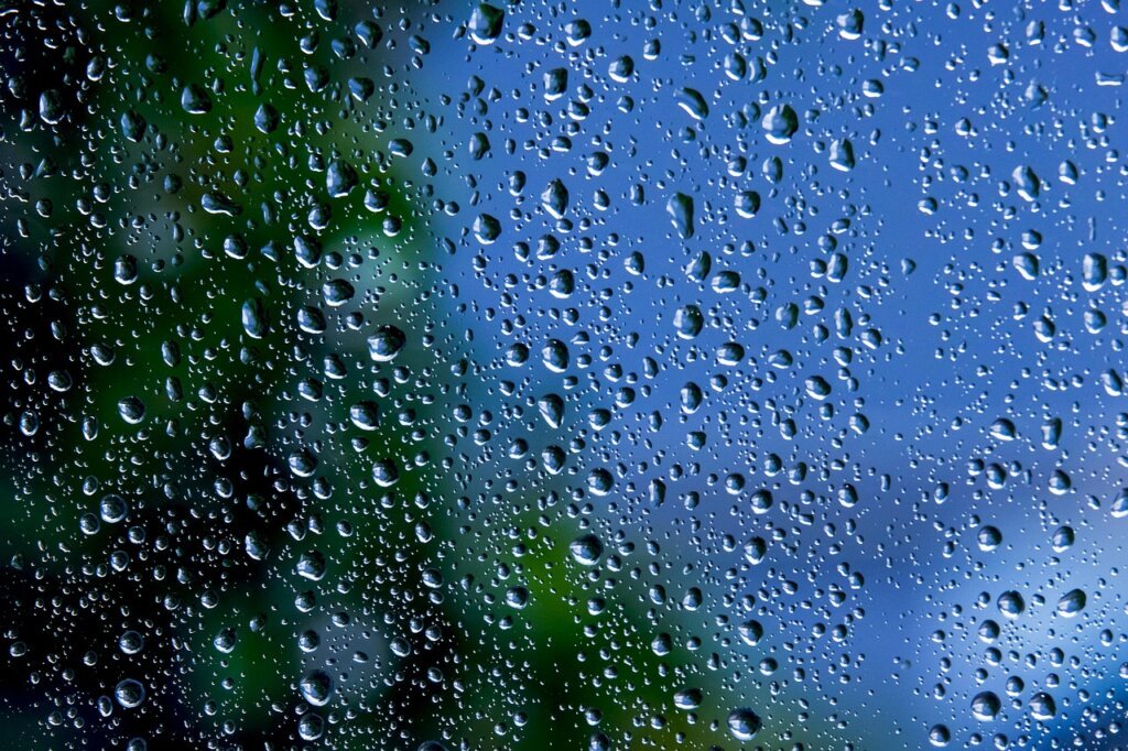 wet entryway tile during rainy season with water droplets visible