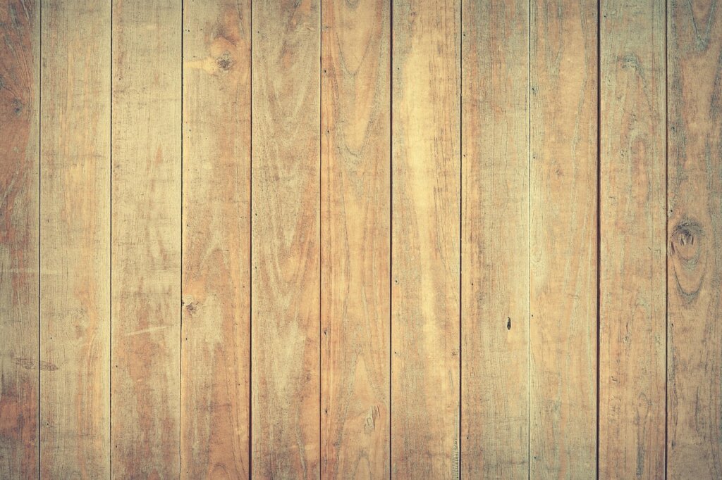 shiny clean hardwood floor reflecting natural sunlight after wax restoration