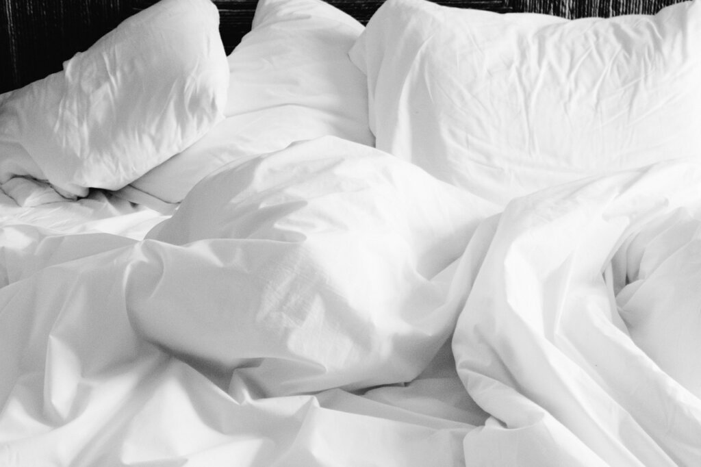 different fabric labels on bed sheets close-up